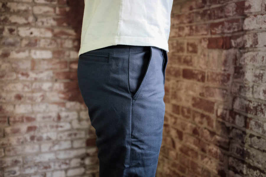Side view of the pockets on the navy selvedge chinos
