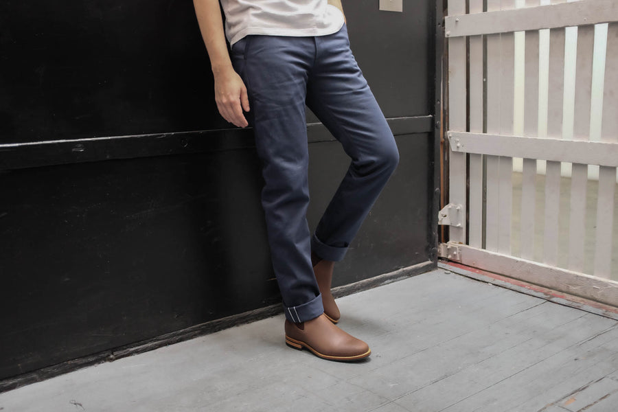 Model leaning against a wall 