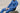 A close up shot of a man in a french blue shirt and work pants.