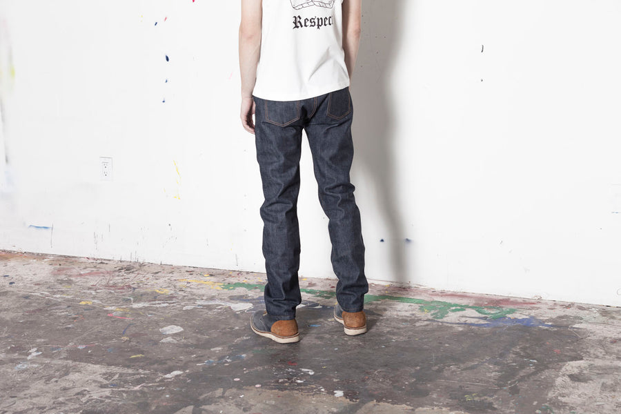 Rear view of the CT-100x denim to show back rise and back pockets.