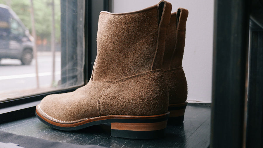 Roper style boots on window shelf.