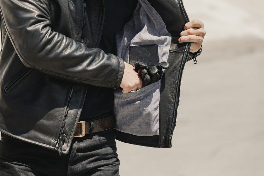 Close up view on the interior leather patch and pocket of the jacket.