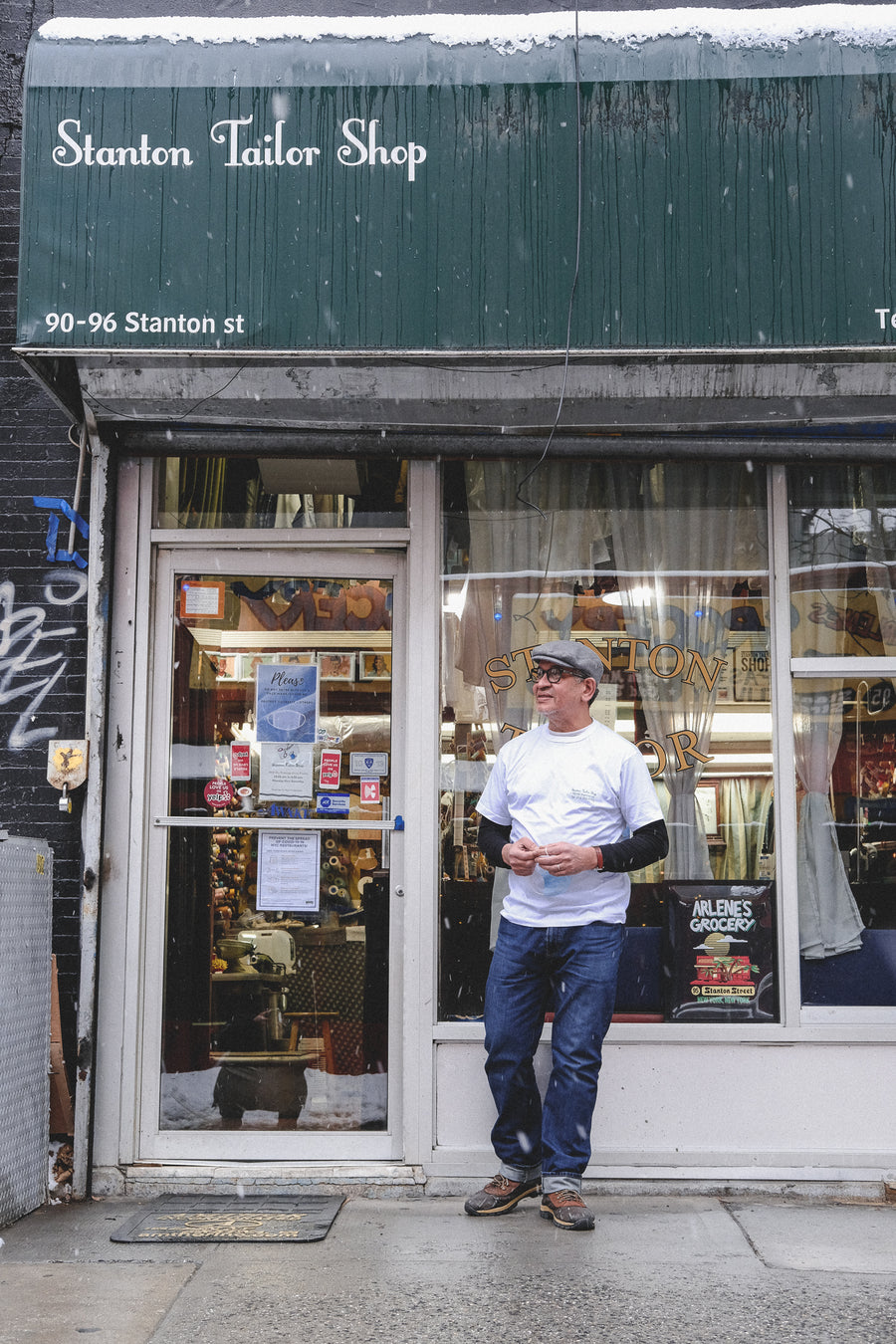 Pablo stands outside his tailor shop on Stanton Street.