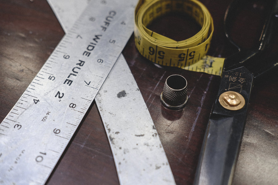 A ruler, measuring tape and some scissors.