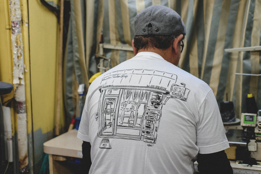 Pablo sewing a garment.