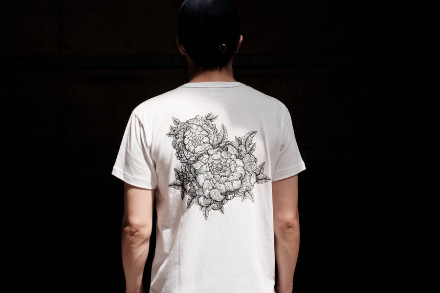View of the back of the white Chrysanthemums shirt depicting two Chrysanthemums.