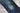 Closeup of a tear in the knee of a pair of SL-120x denim.