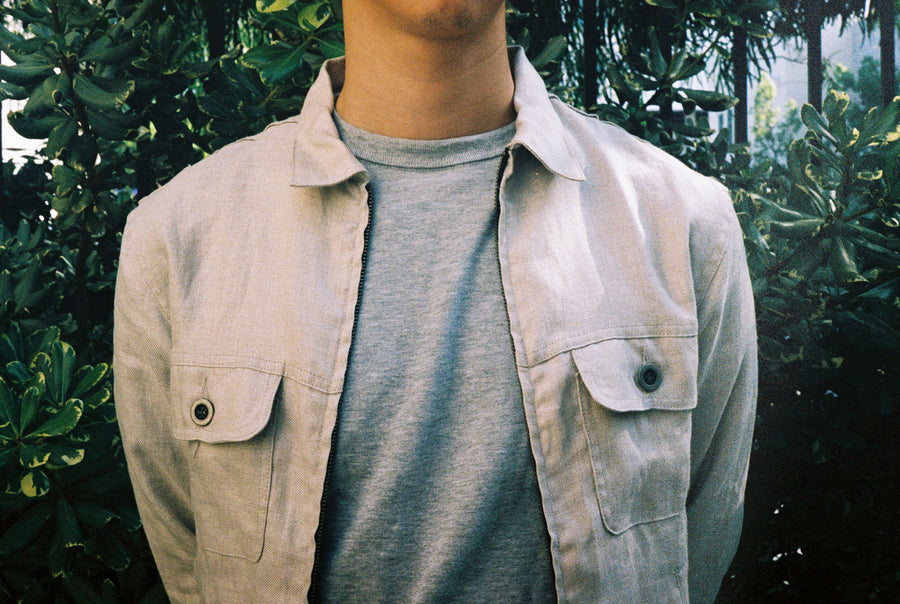 A detailed look at the front chest pockets of the Mechanic Jacket, which feature grey pewter buttons.