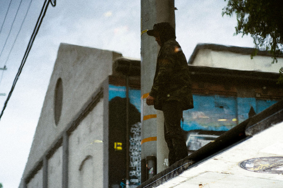 A standing water reflection of a man standing.