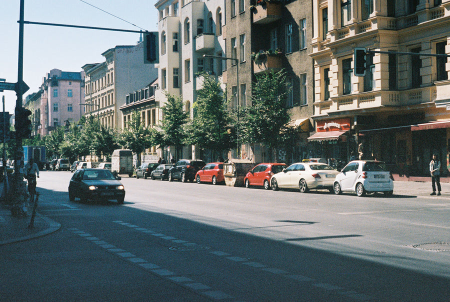 A charming street in Berlin lined with old buildings.