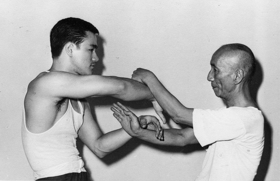 Ip Man and Bruce Lee sparring.