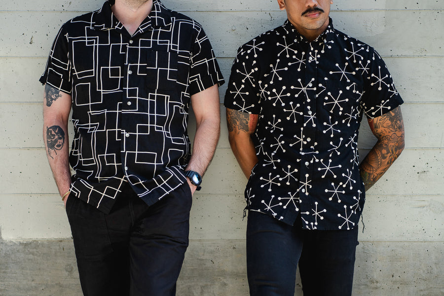 Two men stand side by side wearing 3sixteen shirts
