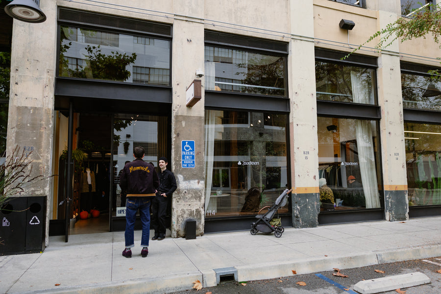 An outside shot of a store with concrete frontage.