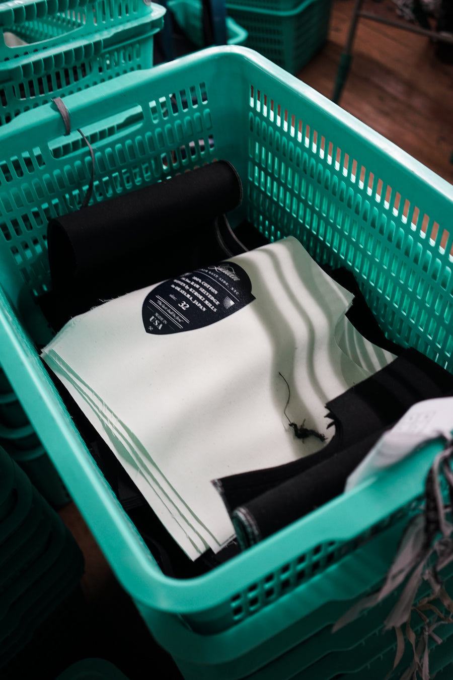 A basket holds cut pocketbag fabrics.