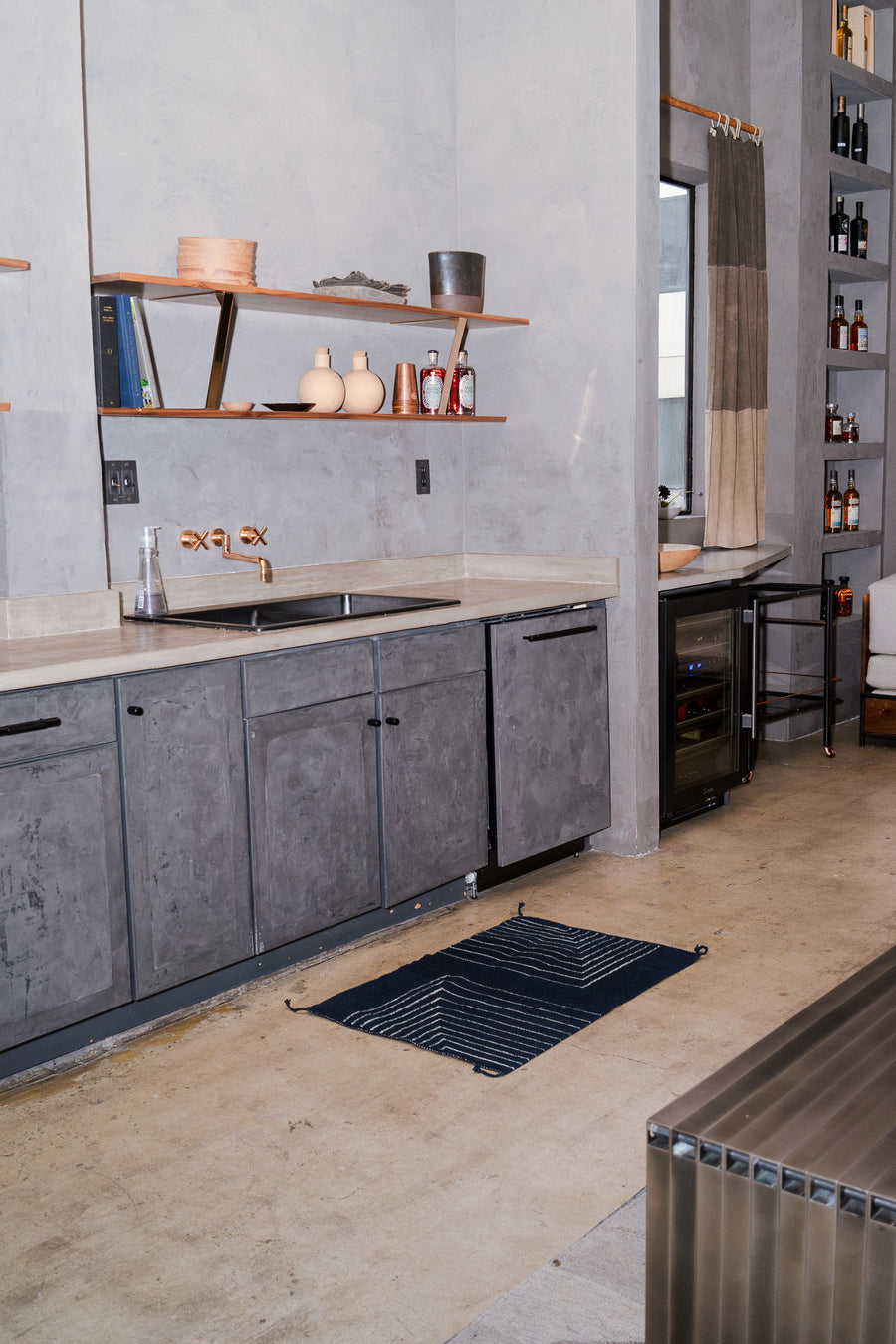 A smaller version of the rug in the kitchen, by the sink.