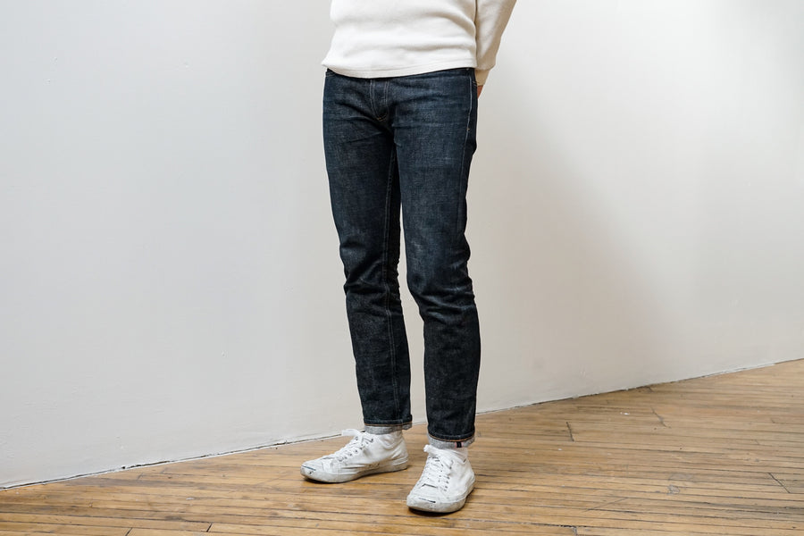 The model poses and gives us a good look at the fit of the NT jeans, which are roomy in the top block with a nice taper from the knee down.