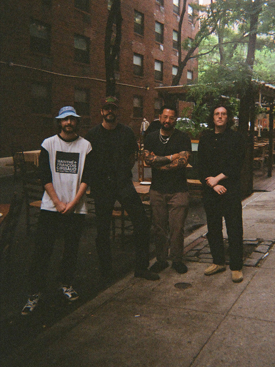 Four cool guys on the street.