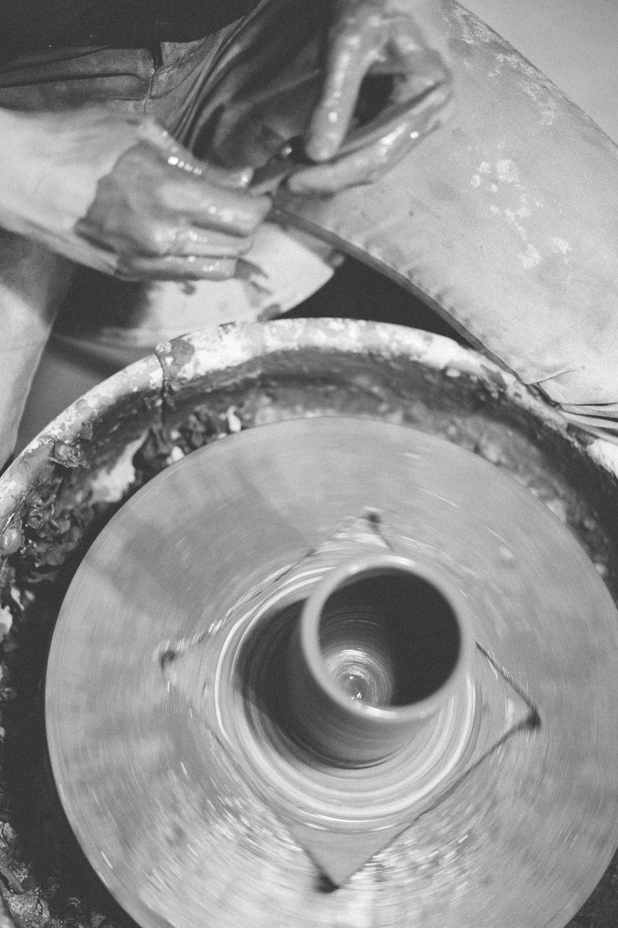 Close up view of man molding mug.