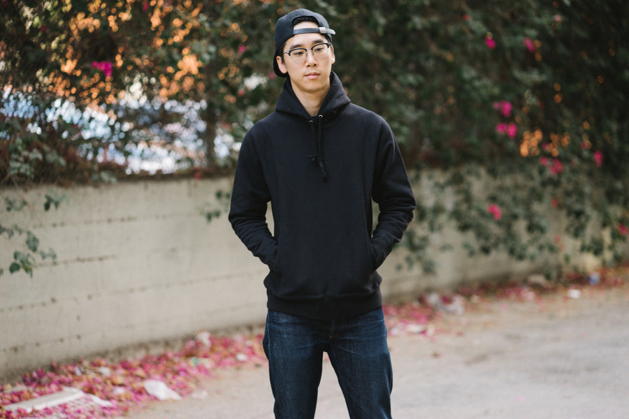Full look of a black pullover on a model