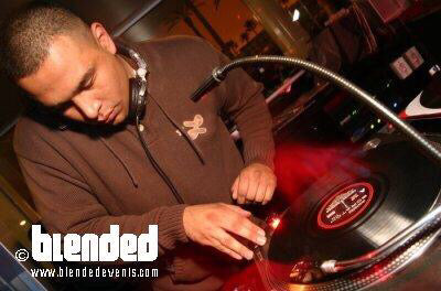 A young Roland aka DJ Roland Blunts spinning music in a nightclub.