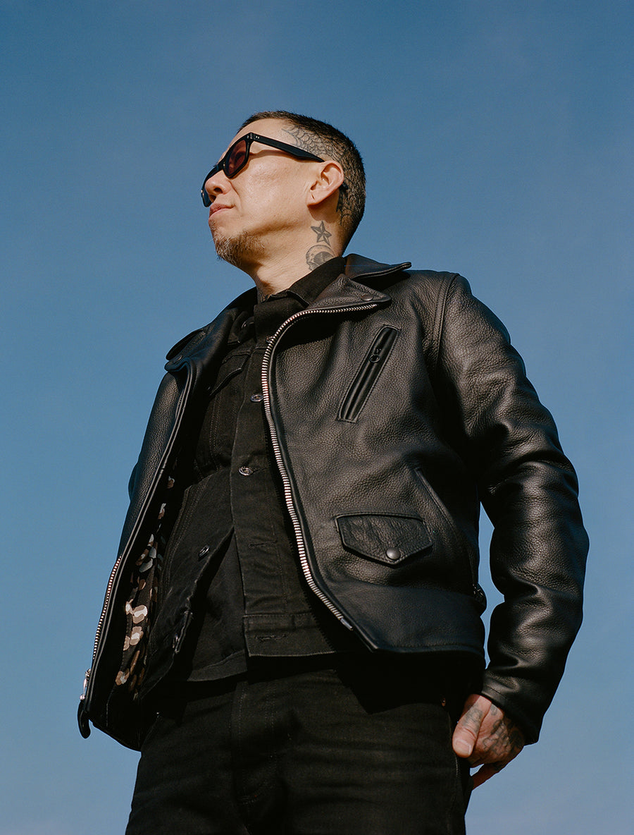 The jacket's leopard print liner peeks through.