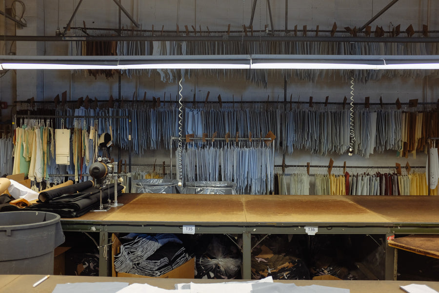 A library of jacket patterns hang from rods.