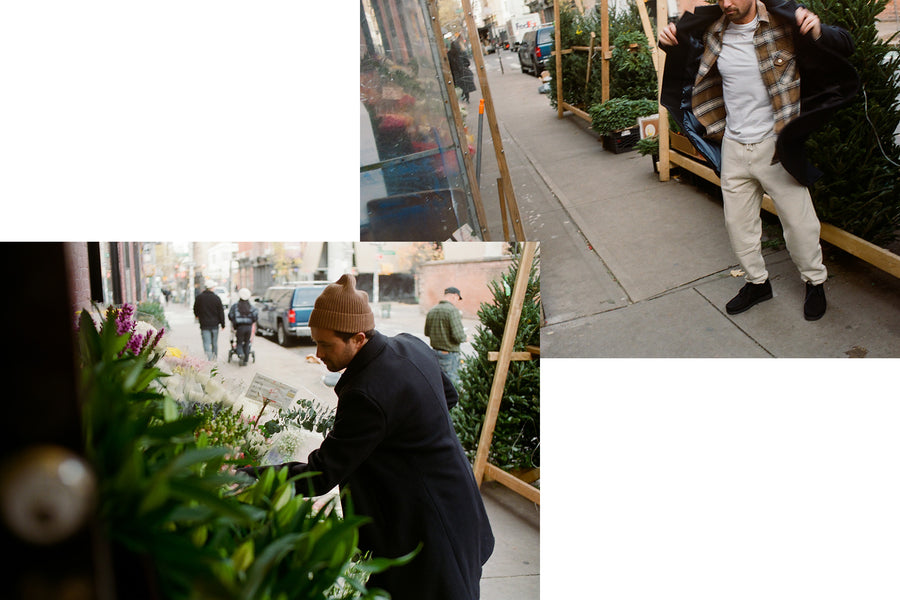 A diptych of a man digging through bins of flowers in a wool coat.