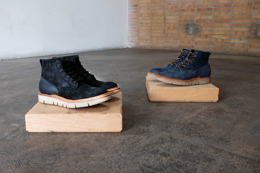 Displayed here are both pairs of our new gloxi-cut scout boots in the navy latigo and charcoal charmois color way.