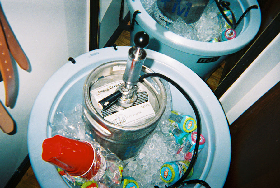A keg in a bucket of ice.