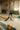 A man bowls in an old bowling alley.