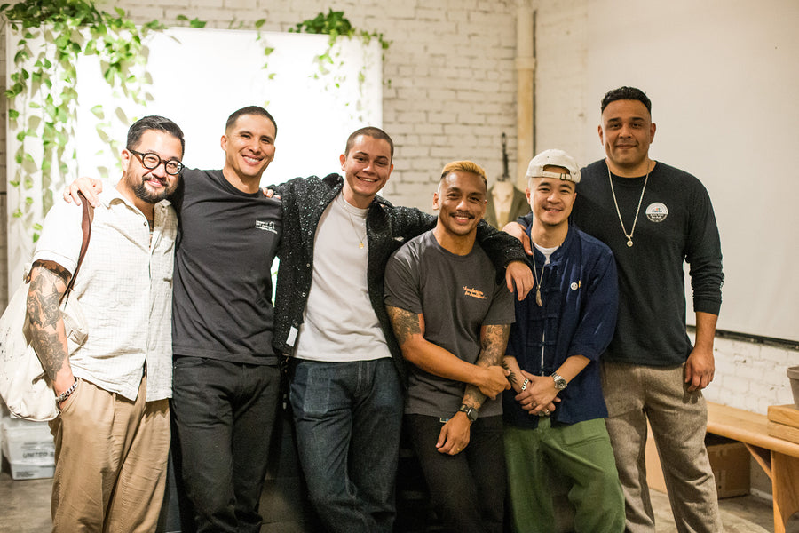 A team of 6 guys in a shop.