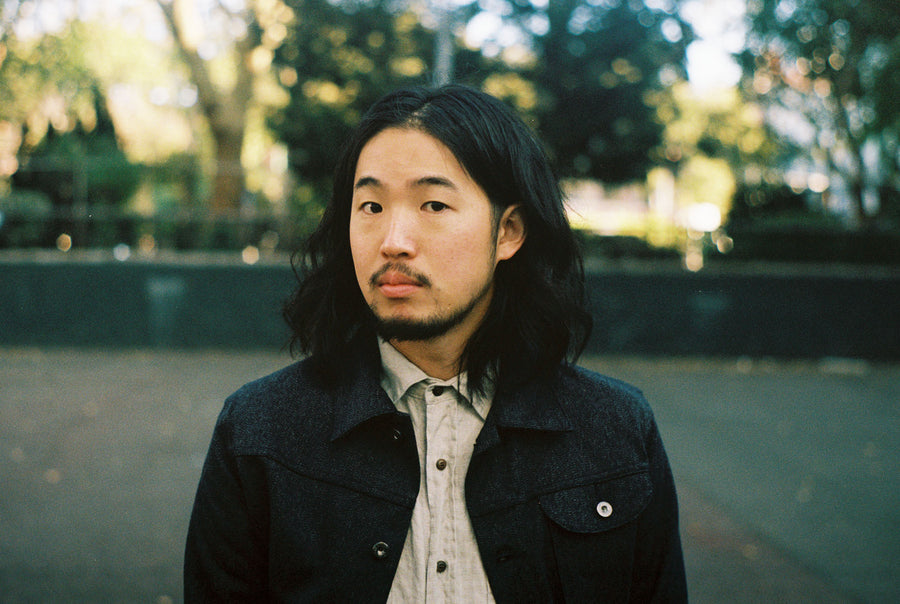 A portrait of the model looking into the camera wearing the ranch jacket.