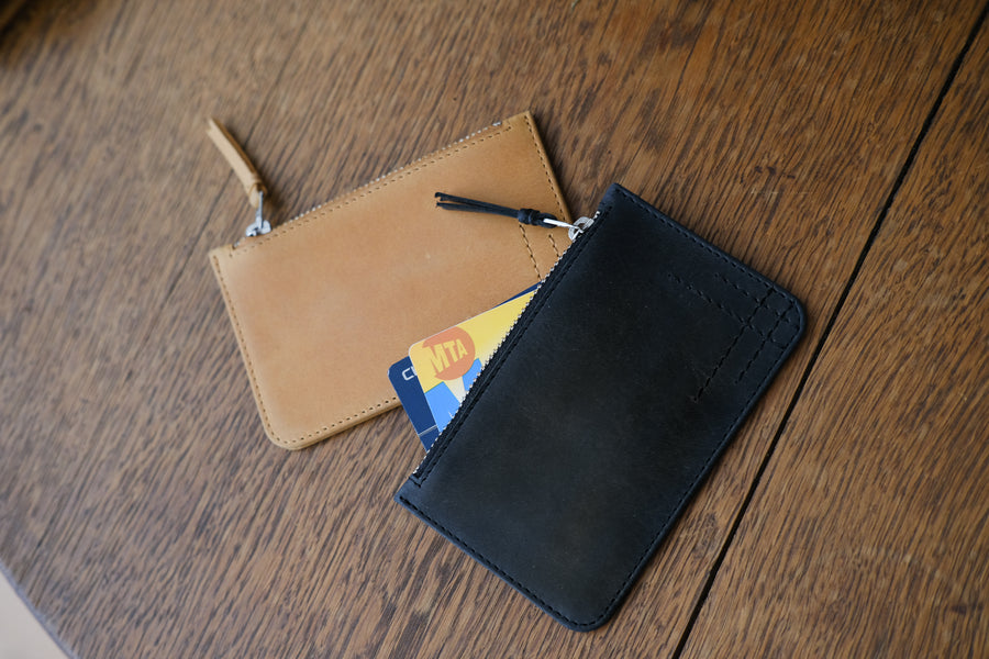 Two zip wallets side by side